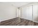 Bedroom with wood-look floors and double door closet at 9739 Sw 79Th Lane Rd, Ocala, FL 34481