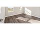 Bright bedroom with wood-look floors and two windows at 9739 Sw 79Th Lane Rd, Ocala, FL 34481