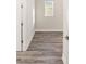 Spacious bedroom with wood-look floors and a window at 9739 Sw 79Th Lane Rd, Ocala, FL 34481