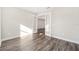 Bedroom with wood-look floors and double doors at 9739 Sw 79Th Lane Rd, Ocala, FL 34481