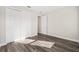 Bedroom with wood-look floors and double door closet at 9739 Sw 79Th Lane Rd, Ocala, FL 34481