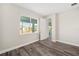 Bedroom with wood-look floors and access to patio at 9739 Sw 79Th Lane Rd, Ocala, FL 34481