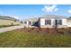 Single-story house with a two-car garage and manicured lawn at 9739 Sw 79Th Lane Rd, Ocala, FL 34481