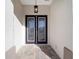 Double front doors with glass inserts leading into the home at 9739 Sw 79Th Lane Rd, Ocala, FL 34481