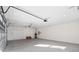 Large garage with an open garage door and concrete floor at 9739 Sw 79Th Lane Rd, Ocala, FL 34481