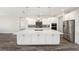 Modern kitchen featuring a large island, stainless steel appliances, and white cabinetry at 9739 Sw 79Th Lane Rd, Ocala, FL 34481