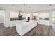 Spacious kitchen with white cabinets, granite countertops and stainless steel appliances at 9739 Sw 79Th Lane Rd, Ocala, FL 34481