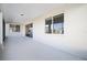 Covered porch with sliding glass door and windows at 9739 Sw 79Th Lane Rd, Ocala, FL 34481