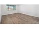 Bright bedroom with wood-look flooring and large window at 9757 Sw 79Th Lane Rd, Ocala, FL 34481