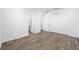 Bright bedroom with wood-look floors and access to bathroom at 9757 Sw 79Th Lane Rd, Ocala, FL 34481