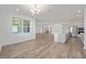 Open dining area with wood-look floors and kitchen views at 9757 Sw 79Th Lane Rd, Ocala, FL 34481