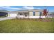 Single-story house with landscaped yard and two-car garage at 9757 Sw 79Th Lane Rd, Ocala, FL 34481