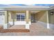 Covered front porch with paver flooring and a modern front door at 9757 Sw 79Th Lane Rd, Ocala, FL 34481