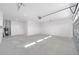 Garage with concrete floor, water heater and door to outside at 9757 Sw 79Th Lane Rd, Ocala, FL 34481