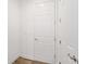 Bright hallway with wood-look floors and white doors at 9757 Sw 79Th Lane Rd, Ocala, FL 34481
