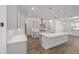 Modern kitchen with island, stainless steel appliances, and white cabinets at 9757 Sw 79Th Lane Rd, Ocala, FL 34481