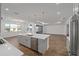Modern kitchen with island, stainless steel appliances, and white cabinets at 9757 Sw 79Th Lane Rd, Ocala, FL 34481
