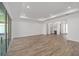 Open concept living area showcasing wood-look floors and natural light at 9757 Sw 79Th Lane Rd, Ocala, FL 34481