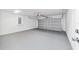 Garage with gray epoxy flooring and an automatic garage door at 10161 Sw 137Th Ct, Dunnellon, FL 34432