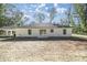 Rear view of the house with sliding glass doors at 12051 Sw 39Th Ln, Ocala, FL 34481