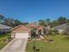 Single-story home with a large backyard and driveway at 12152 Se 91St Ave, Summerfield, FL 34491