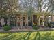 Backyard view of the home's screened patio and garden at 12152 Se 91St Ave, Summerfield, FL 34491