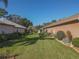 Backyard showcasing a neatly landscaped lawn at 12152 Se 91St Ave, Summerfield, FL 34491