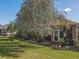 Backyard with a screened patio and grill area at 12152 Se 91St Ave, Summerfield, FL 34491