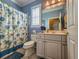 Clean bathroom with a toilet, vanity, and shower bathtub at 12152 Se 91St Ave, Summerfield, FL 34491