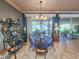Charming dining room with chandelier, and access to the kitchen at 12152 Se 91St Ave, Summerfield, FL 34491