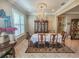 Formal dining room with large oval table and china cabinet at 12152 Se 91St Ave, Summerfield, FL 34491