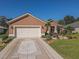 Well maintained Ranch home featuring a 2-car garage and attractive landscaping at 12152 Se 91St Ave, Summerfield, FL 34491