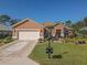 Beautiful Ranch home with 2 car garage, mature landscaping, and decorative driveway at 12152 Se 91St Ave, Summerfield, FL 34491