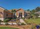 Well-maintained house with a nicely landscaped front yard and walkway at 12152 Se 91St Ave, Summerfield, FL 34491