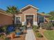Attractive home exterior featuring a double door entry and lush landscaping at 12152 Se 91St Ave, Summerfield, FL 34491