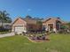 Single-story house with a two-car garage and manicured lawn at 12152 Se 91St Ave, Summerfield, FL 34491