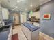 Modern kitchen with island, stainless steel appliances, and ample counter space at 12152 Se 91St Ave, Summerfield, FL 34491