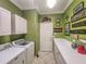 Bright laundry room with washer, dryer, cabinets, and countertop at 12152 Se 91St Ave, Summerfield, FL 34491