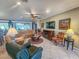 Spacious living room with comfortable seating, a large TV, and a fireplace at 12152 Se 91St Ave, Summerfield, FL 34491