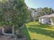 Spacious backyard with mature trees and landscaping at 12152 Se 91St Ave, Summerfield, FL 34491
