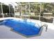 Inviting, screened-in pool with tiled coping at 1275 Russell Loop, The Villages, FL 32162