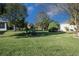 Landscaped backyard with lush grass and mature trees at 15750 Sw 11Th Court Rd, Ocala, FL 34473