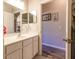 Bright bathroom with a double vanity and access to a small room at 15750 Sw 11Th Court Rd, Ocala, FL 34473