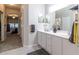 Double vanity bathroom with a view of the bedroom and an additional closet at 15750 Sw 11Th Court Rd, Ocala, FL 34473