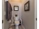 Small bathroom with toilet, grab bars, and neutral decor at 15750 Sw 11Th Court Rd, Ocala, FL 34473