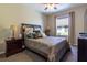 Comfortable bedroom with a queen-size bed and ceiling fan at 15750 Sw 11Th Court Rd, Ocala, FL 34473