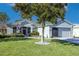 Beautiful one-story home with a well-manicured lawn and attached garage at 15750 Sw 11Th Court Rd, Ocala, FL 34473