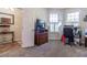 Bright home office features built-in shelving and plenty of natural light at 15750 Sw 11Th Court Rd, Ocala, FL 34473