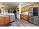 Spacious kitchen with island, stainless steel appliances, and hardwood floors at 15750 Sw 11Th Court Rd, Ocala, FL 34473