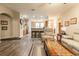 Open and bright living room with hardwood floors, and kitchen access at 15750 Sw 11Th Court Rd, Ocala, FL 34473